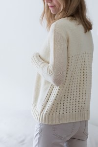Knitted sweater with mesh lace back. Knitting pattern: Rhilea by Suvi Simola.