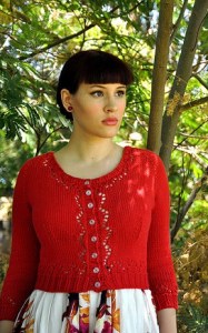 Vintage style, red lace cardigan with shallow scoop neck.