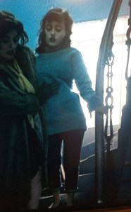 Long, cabled sweater worn by Ella Purnell as Hester Argyll in Ordeal by Innocence (BBC 2018) .