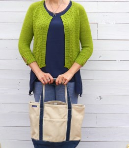 Short, lime green knitted cardigan with textured details.