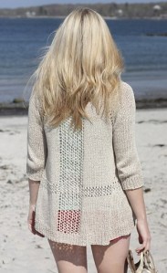 Knitted long cardigan with mesh lace panels. Knitting pattern: Sandshore by Alicia Plummer