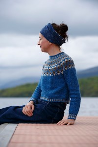 blue sweater with Fair Isle colour work yoke and borders, designed by Kate Davies.