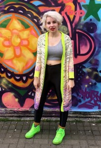 Long cardigan in variegated yarn with contrast colour cuffs and button band, designed by Chantal Belisle.