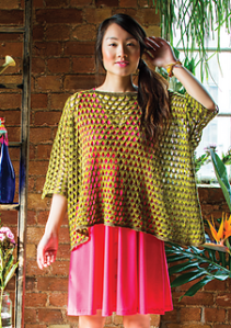 Model wearing chartreuse, knitted mesh, oversized sweater. Knitting pattern by Anna Maltz.