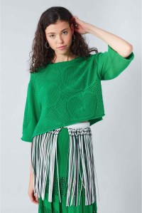 Model wearing cropped, oversized, cotton mesh front sweater with inset apple motifs. From Sonia Rykiel Summer 2019.